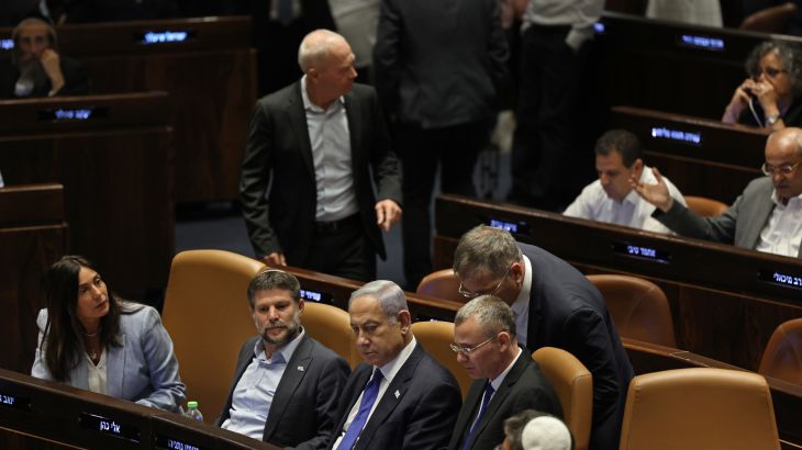 Israel's Prime Minister Benjamin Netanyahu (C) attends a parliament session in Jerusalem