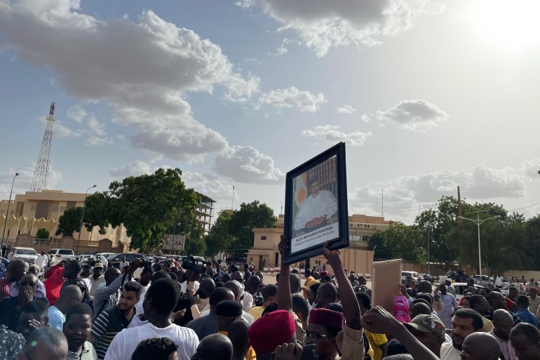 Supporters of Nigerien President Mohamed Bazoum gather to show their support for him in Niamey on July 26