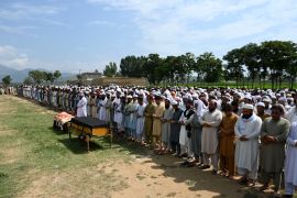 People offer funeral prayers to the victims who died in a bomb blast in Bajaur district of Khyber-Pakhtunkhwa province on July 31, 2023. - At least 44 people were killed and more than 100 others wounded on July 30 by a suicide bombing at a political gathering of a leading Islamic party in northwest Pakistan, officials said. (Photo by Abdul MAJEED / AFP)