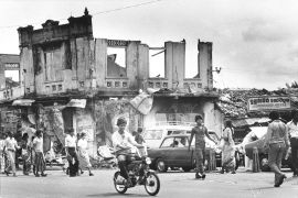 Residents of the capital city of Colombo, Sri Lanka, return to this market area to re-supply their home needs following 5 days of riots and fire, July 29, 1983. Thousands of homes and businesses were destroyed by the riots which continue Friday. (AP Photo/Jeff Robbins)