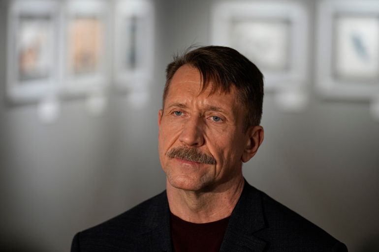 A close up photo of Viktor Bout. He has a moustache and his brown hair is closely cropped at the sides.