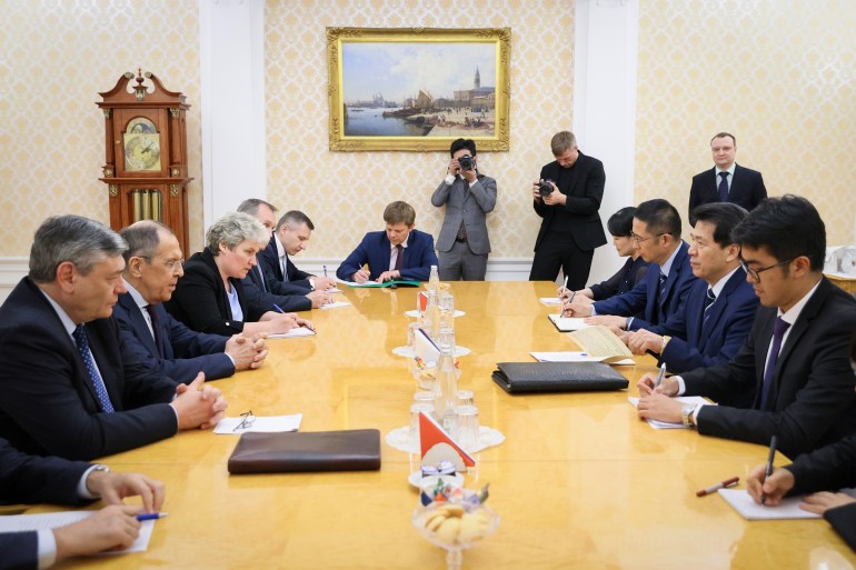 In this handout photo released by Russian Foreign Ministry Press Service, Russian Foreign Minister Sergey Lavrov, 2nd left, and Li Hui, China's special envoy for Eurasian affairs, 2nd right, speak during their meeting in Moscow, Russia, Friday, May 26, 2023. (Russian Foreign Ministry Press Service via AP)