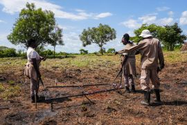 A team of deminers do clearance at a site containing cluster munitions in Ayii, Eastern Equatoria state, in South Sudan Thursday, May 11, 2023