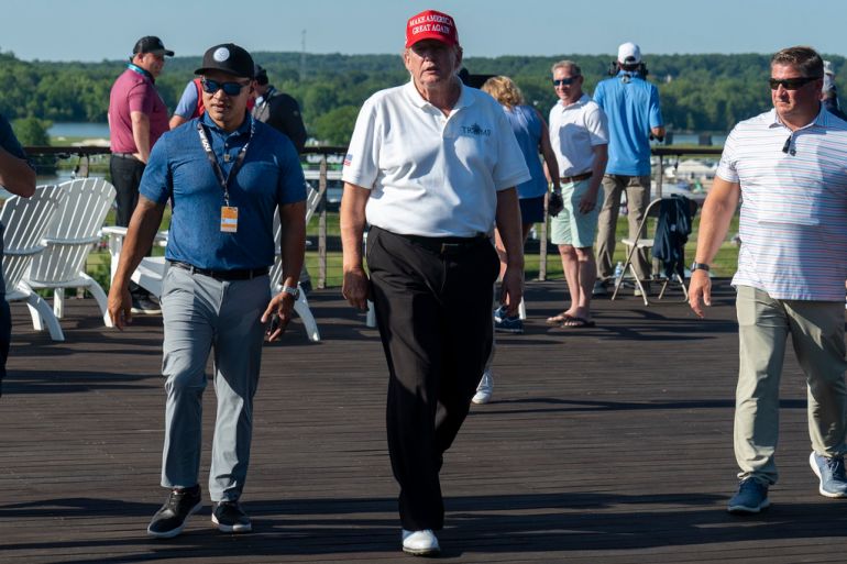 Walt Nauta walking with Donald Trump