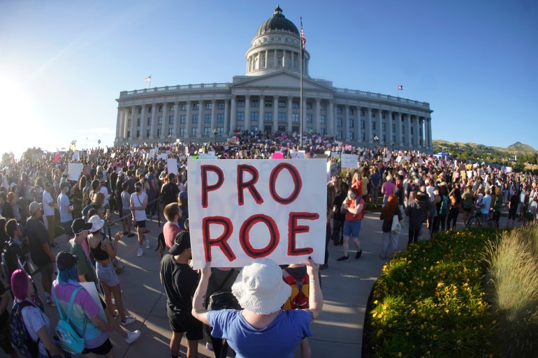 A person holds a pro-Roe sign