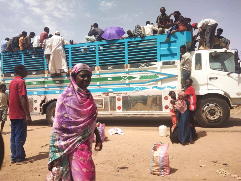 People board a truck as they leave Khartoum, Sudan, Monday, June 19, 2023. Sudan's warring parties have begun another attempt at a cease-fire after more than two months of brutal fighting — and ahead of an international conference to raise funds for humanitarian assistance. (AP Photo)
