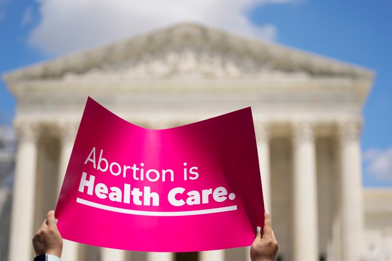 Pink sing in front of Supreme Court says: Abortion is Healthcare