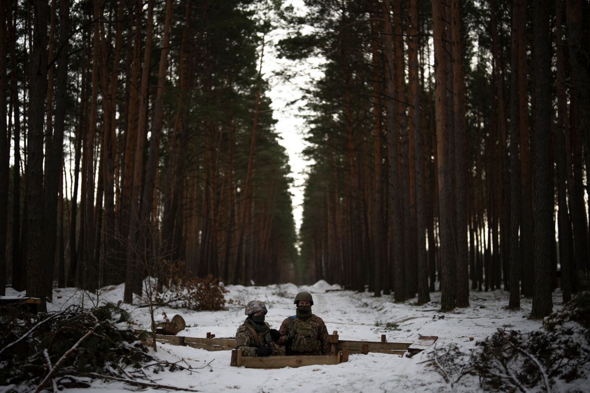 Ukrainian servicemen stand at a position close to the border with Belarus,