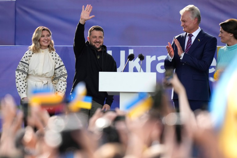 Ukrainina President Volodymyr Zelenskyy waving during an appearance in Vilnius
