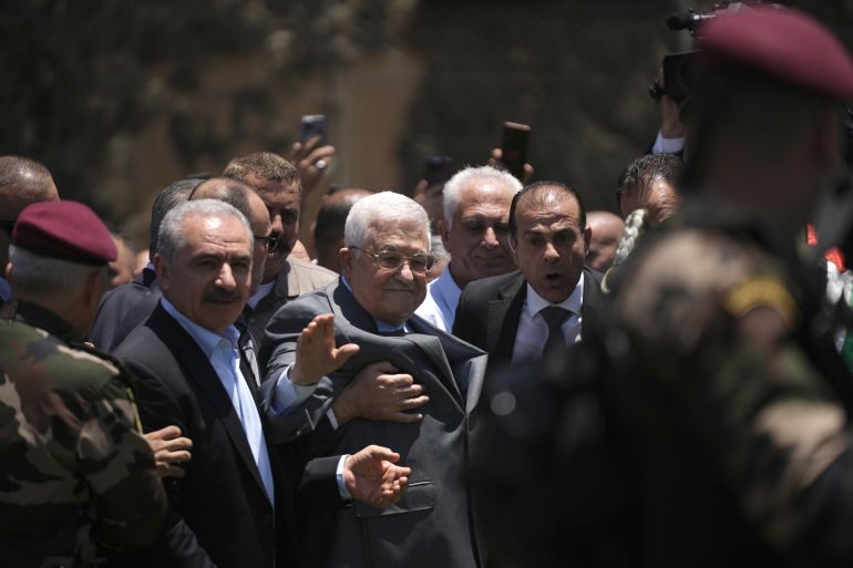 Palestinian President Mahmoud Abbas, center, visits the Jenin refugee camp in the West Bank