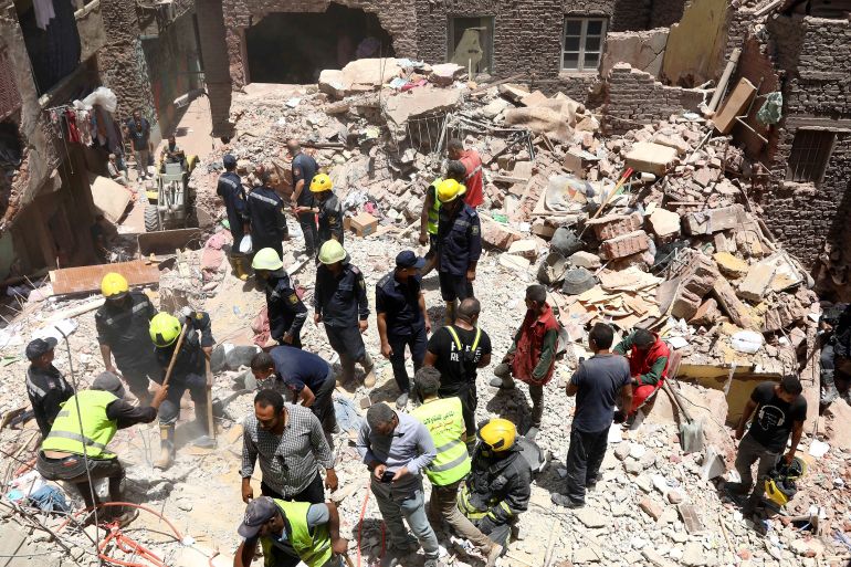 Rescuers search through the rubble of a collapsed five-story apartment building in Cairo, Egypt, Monday, July 17, 2023. A five-story apartment building collapsed Monday in the Egyptian capital of Cairo, leaving several people dead, authorities said