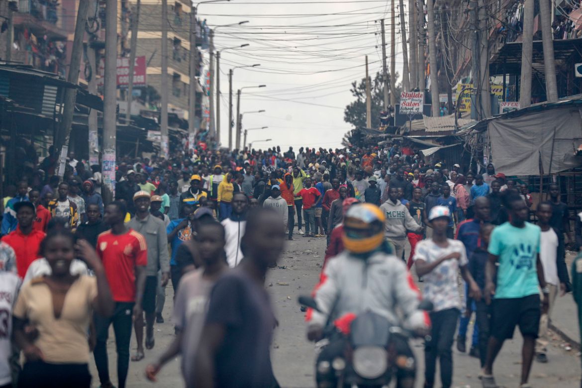 Protesters stand on the road during clashes in the Mathare area of Nairobi,
