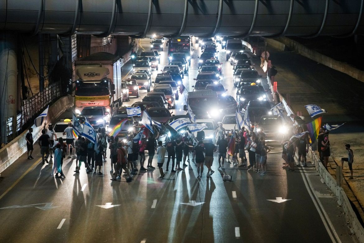 Demonstrators block a highway during a protest