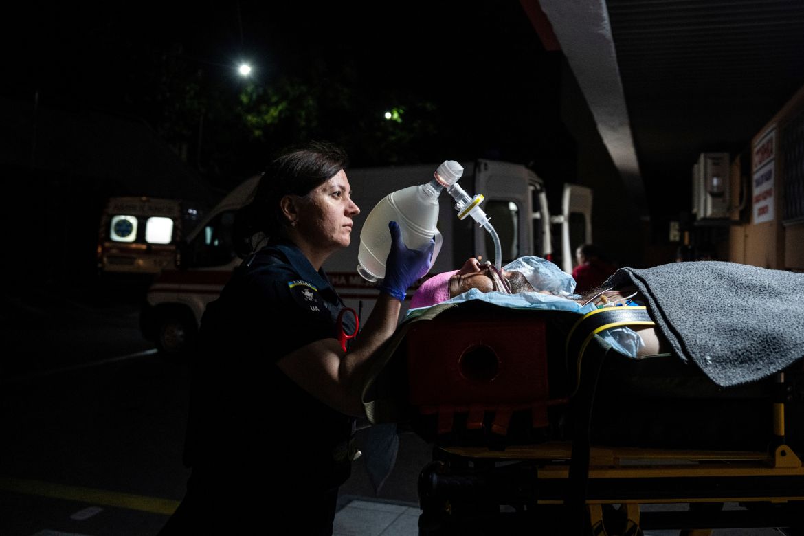 A paramedic transports a seriously wounded Ukrainian serviceman