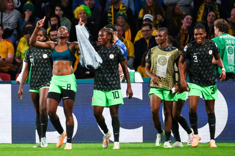 Nigeria's Asisat Oshoala, left, celebrates with teammates after scoring their side's third goal during the Women's World Cup Group B soccer match between Australia and Nigeria In Brisbane, Australia