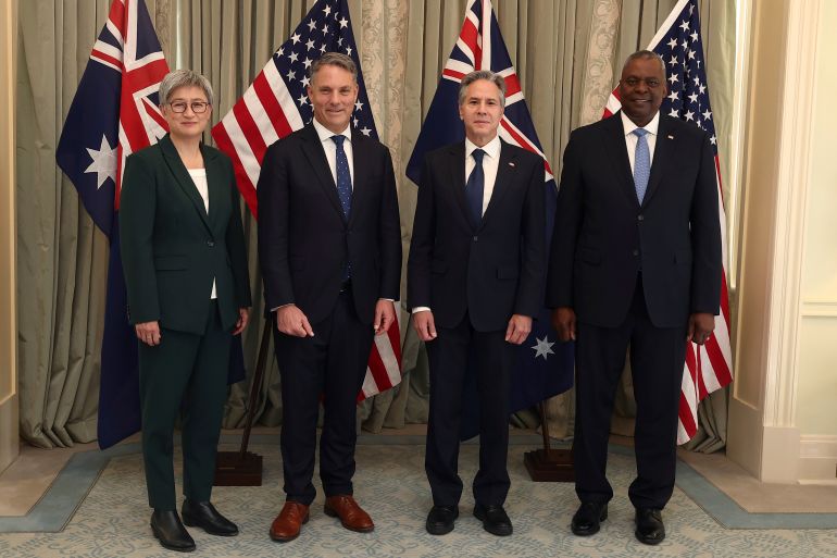 From left to right, Australia's Foreign Minister Penny Wong, Australia's Deputy Prime Minster and Defense Minister Richard Marles, U.S. Secretary of State Antony Blinken and U.S. Secretary of Defense Lloyd Austin pose for a photo at Queensland Government House in Brisbane, Australia, Saturday, July 29, 2023