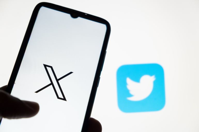 In this photo illustration a X logo is displayed on a smartphone screen and a Twitter logo on a MacBook screen in Athens, Greece on July 24, 2023. Twitter unveils X logo to replace Larry the bird. (Photo Illustration by Nikolas Kokovlis/NurPhoto via Getty Images)