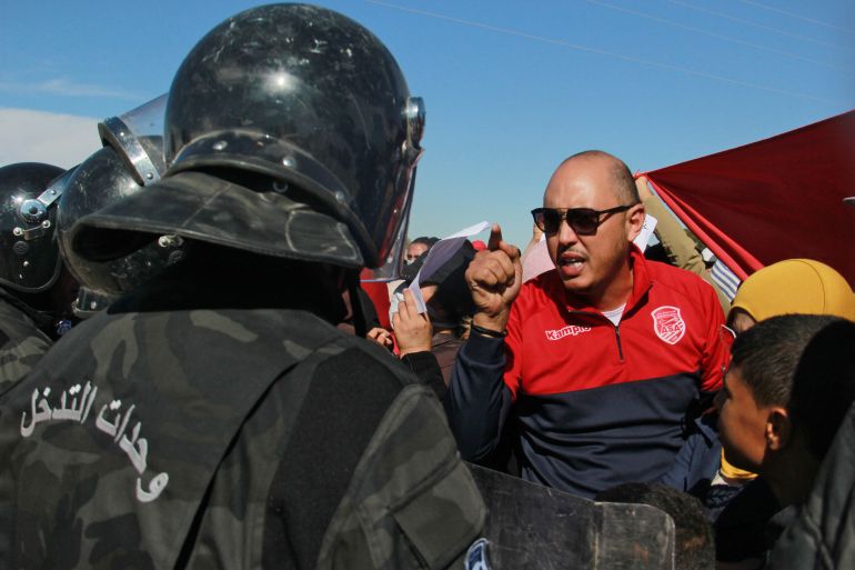 Man speaks with Tunisian police