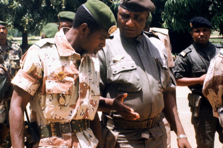 The new military ruler of Niger, Major Daouda Mallam Wanke (R) chats with his chief of staff, Lieutenant Colonel Zanguina, as he makes his first public appearance14 April 1999 in Niamey, since the coup in which his predecessor Ibrahim Bare Mainassa was killed 09 April 1999