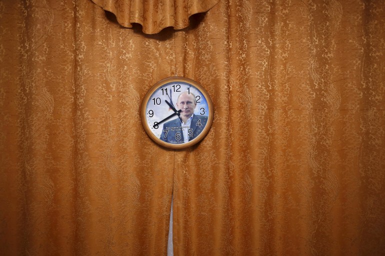 A wall clock with a picture of Russian President Vladimir Putin is seen in this photo illustration taken in a hotel room in Kazan, Russia, July 31, 2015. He may be in charge of an economy in crisis, but if mobile phone covers and souvenir mugs are a barometer of popularity, Russian President Vladimir Putin need not fear for his political future. In fact, Moscowâ€™s annexation of Crimea from Ukraine last year has given the memorabilia makers even more material to glorify, sometimes wryly, a president whose image as a champion of Russian national interests in a hostile world is barely challenged in his own country. REUTERS/Stefan Wermuth TPX IMAGES OF THE DAYTHE IMAGES SHOULD ONLY BE USED TOGETHER WITH THE STORY - NO STAND-ALONE USES. PICTURE 12 OF 17 FOR WIDER IMAGE STORY "FROM RUSSIA WITH LOVE"SEARCH "WERMUTH PUTIN" FOR ALL PICTURES TPX IMAGES OF THE DAY