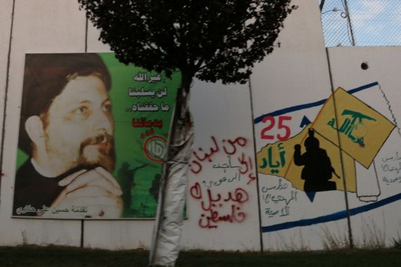 A poster depicting Imam Musa al-Sadr, the founder of the Shi'ite Amal movement, is seen on a wall at Kfar Kila village near the Lebanese-Israeli border, southern Lebanon November 7, 2017