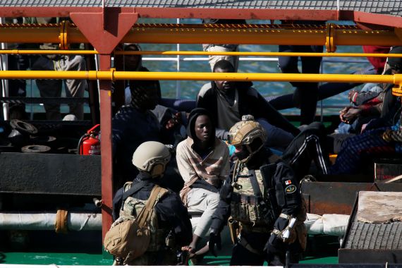 Maltese special forces soldiers guard a group of migrants on the merchant ship Elhiblu 1 after it arrived in Senglea, in Valletta's Grand Harbour, Malta, March 28, 2019. REUTERS/Darrin Zammit Lupi