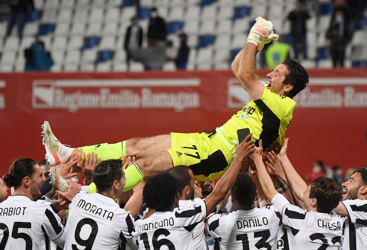 Gianluigi Buffon is tossed up by teammates after winning the Coppa Italia