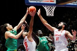 Thon Maker and Tyrese Proctor of Australia lay up against Ali Haidar and Sergio El Darwich of Lebanon