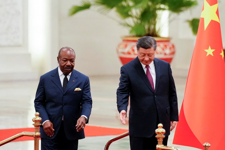 Gabonese President Ali Bongo Ondimba is led by Chinese President Xi Jinping during a welcome ceremony at the Great Hall of the People in Beijing, China, April 19, 2023.