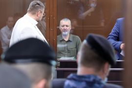 Russian nationalist Kremlin critic and former military commander Igor Girkin, also known as Igor Strelkov, who is charged with inciting extremist activity, sits behind a glass wall of an enclosure for defendants before a court hearing in Moscow, Russia, July 21, 2023. REUTERS/Yulia Morozova