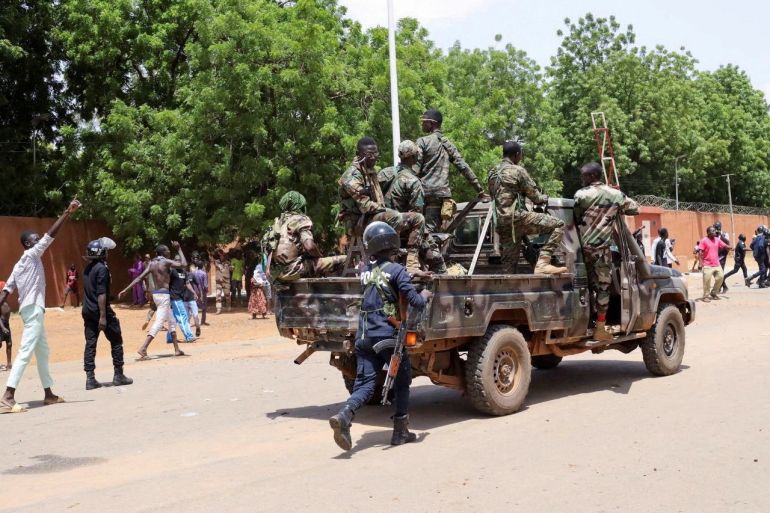 Nigerien security forces prepare to disperse pro-junta demonstrators gathered outside the French embassy, in Niamey, the capital city of Niger.