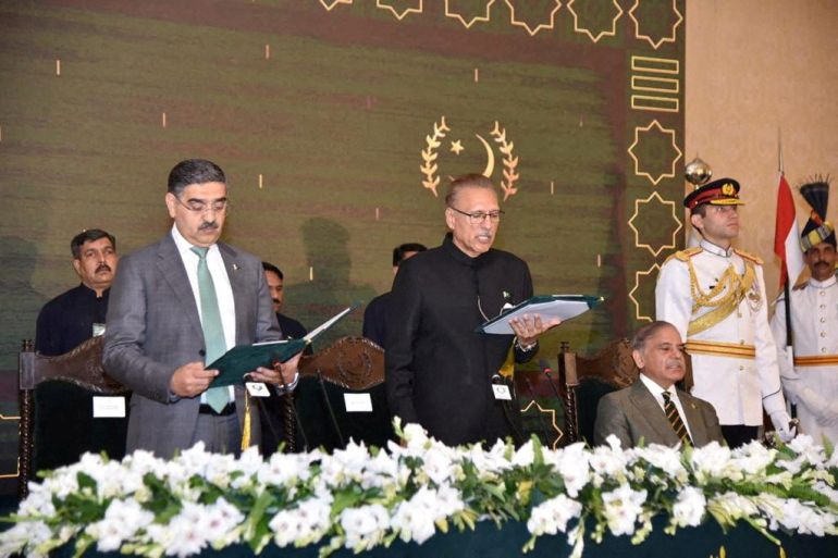 Pakistan's caretaker Prime Minister Anwaar-ul-Haq Kakar takes oath from Pakistan's President Arif Alvi, in Islamabad