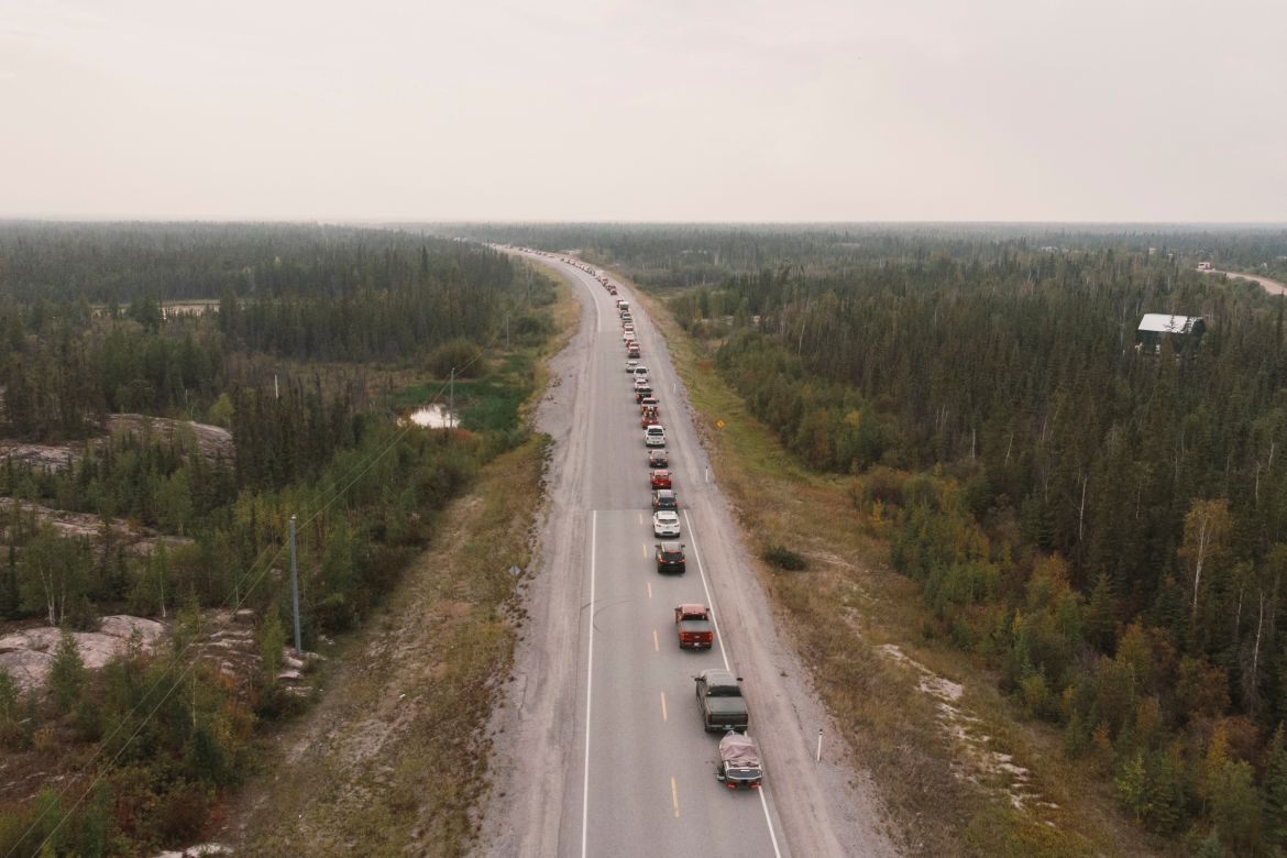 Yellowknife residents leave the city on Highway 3, the only highway in or out of the community, after an evacuation order was given due to the proximity of a wildfire in Yellowknife