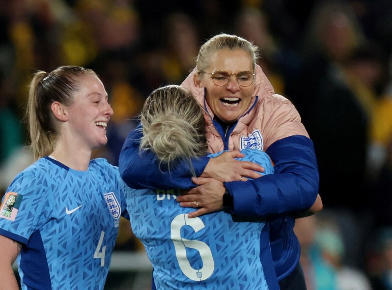 England's Millie Bright and manager Sarina Wiegman celebrate after the match as England progress to the final of the World Cup