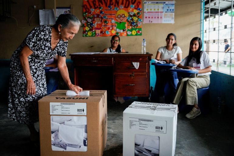 A woman casts her ballot at a polling station during the presidential election in Ecuador