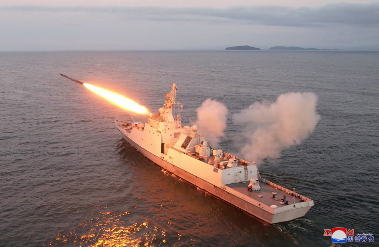 An aerial view of a missile being fired from a North Korean ship