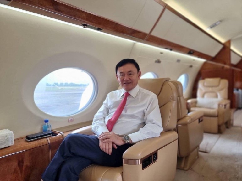 Thaksin looking relaxed on his private jet