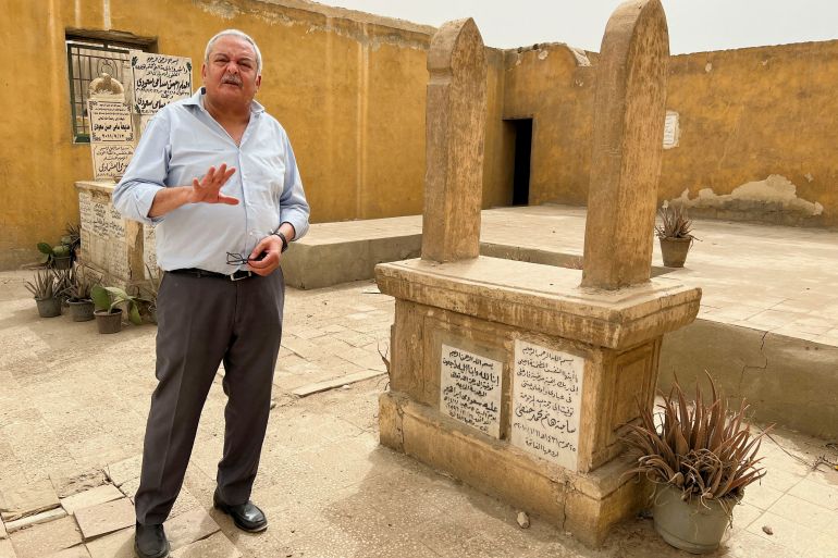 Hisham Kassem, a former newspaper publisher and political activist, speaks during an interview with Reuters TV at his family's cemetery, which is planned to be demolished, across The City of the Dead