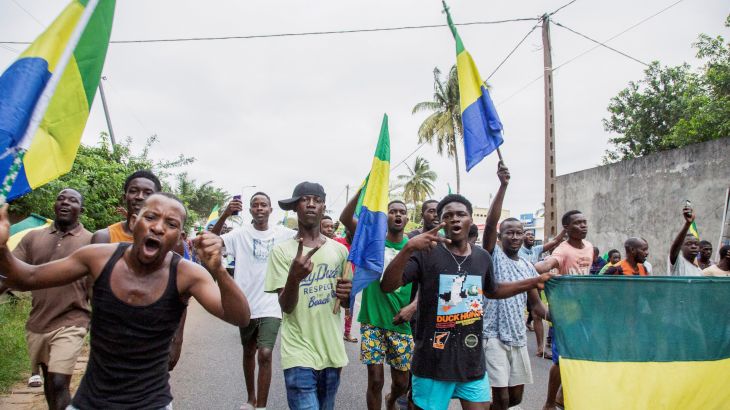 People celebrate in support of the putschists in a street of Port-Gentil, Gabon August 30, 2023.