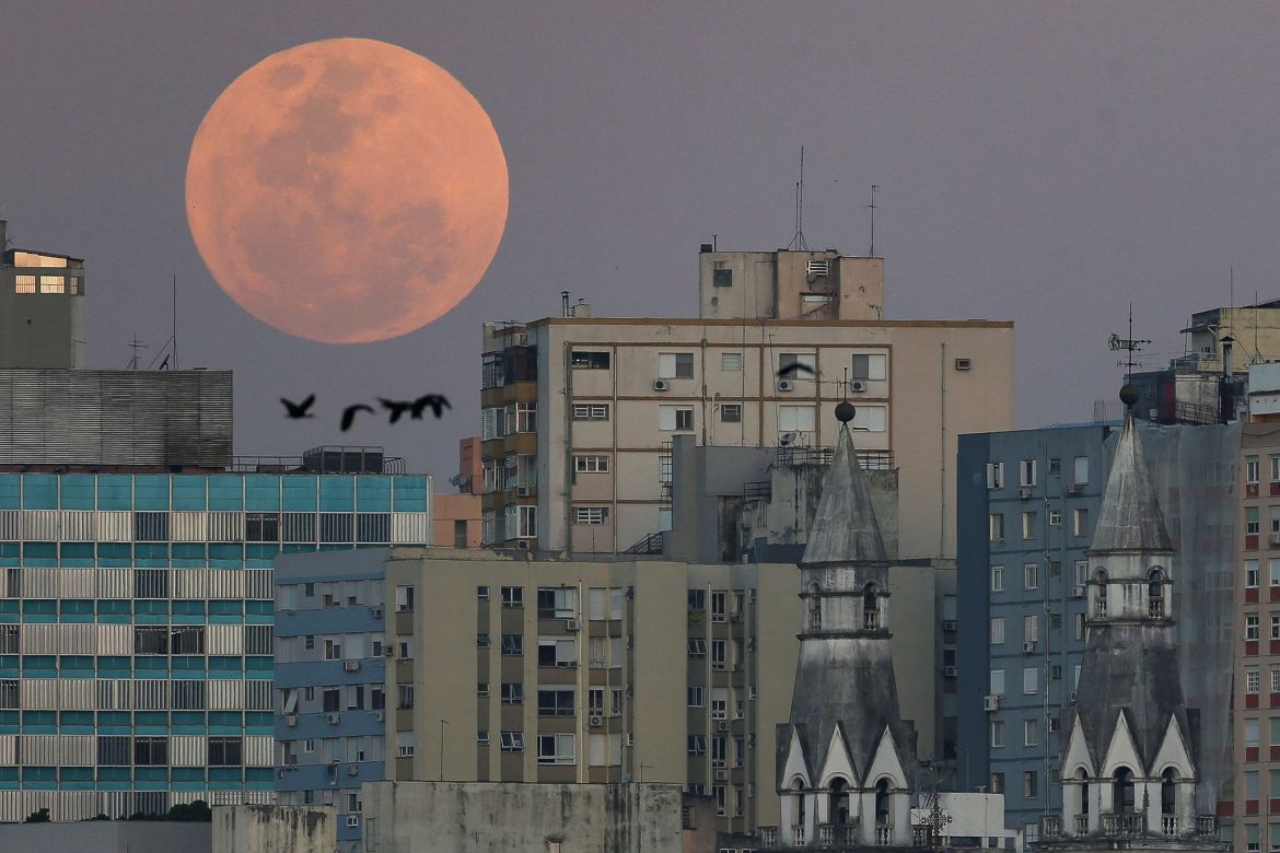 A view shows a full moon known as the 'Blue Moon' over de city of Porto Alegres, Rio Grande