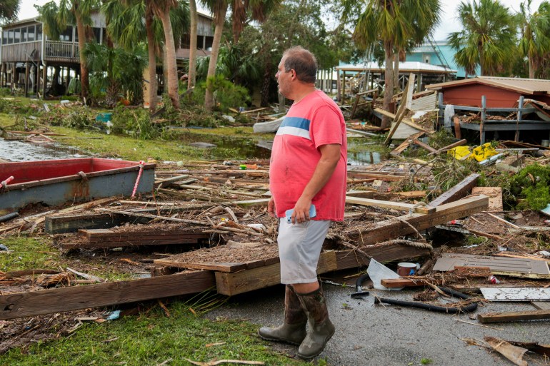 A man assesses the damage caused by Hurricane Idalia in Florida, US
