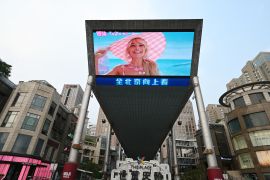 A promotion for the movie "Barbie" is pictured on a giant screen outside a shopping mall in Beijing.