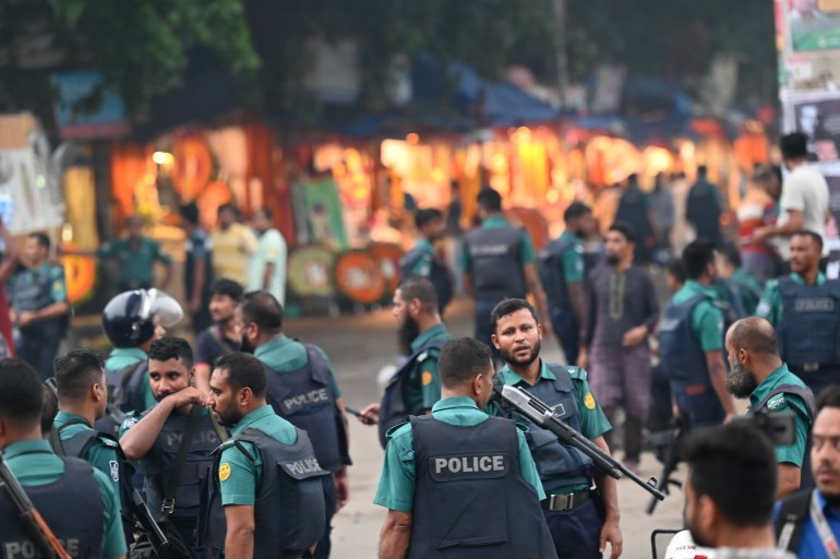 Police stand guard near the hospital where Islamist leader Delwar Hossain Sayedee died in Dhaka