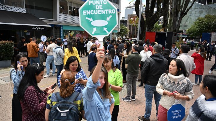 People remain on the streets after an eartquake in Bogota