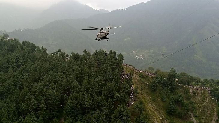 A military helicopter conducts a rescue operation to recover students stuck in a chairlift in the Pashto village of mountainous Khyber Pakhtunkhwa province