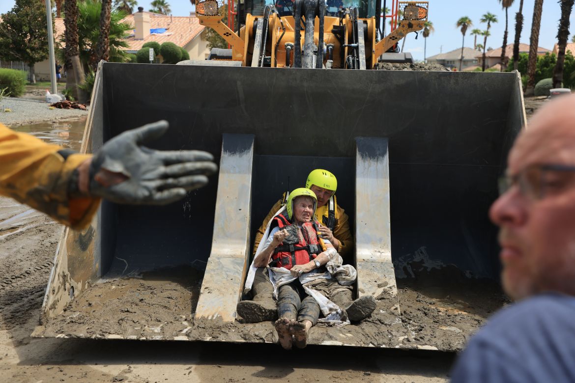 Cathedral City Fire Department rescues residents in a bulldozer following heavy rains from Tropical Storm Hilary in Cathedral City