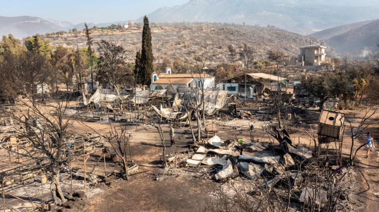 This aerial photograph taken on August 22, 2023 shows the campsite of village of Saranti following a wildfire, near Prodromos