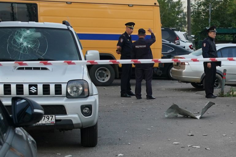 Law enforcement officers work at the site of a drone attack in Krasnogorsk, in the Moscow region on August 22, 2023. - Russian air defences downed two attack drones near Moscow, the city's mayor said on August 22, in the fifth consecutive night of strikes on the capital region. (Photo by STRINGER / AFP)