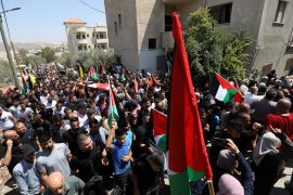 Palestinian mourners carry the body of Othman Abu Khuroj, 17, in the occupied West Bank town of Zababdeh