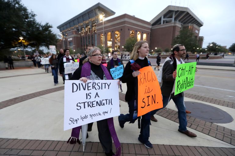 Demonstrators walks past Kyle Field toward the venue where Richard Spencer, who leads a movement that mixes racism, white nationalism and populism, is scheduled to speak at Texas A&amp;M University, Tuesday, Dec. 6, 2016, in College Station, Texas. Spencer is scheduled to speak at Texas A&amp;M University after being invited by a former student. The university is holding a an event to highlight diversity and unity at the same time Spencer is set to speak. (AP Photo/David J. Phillip)